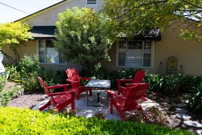 Patio Ideas Budget house backyard with red adirondack chairs table outdoors setting furniture summer