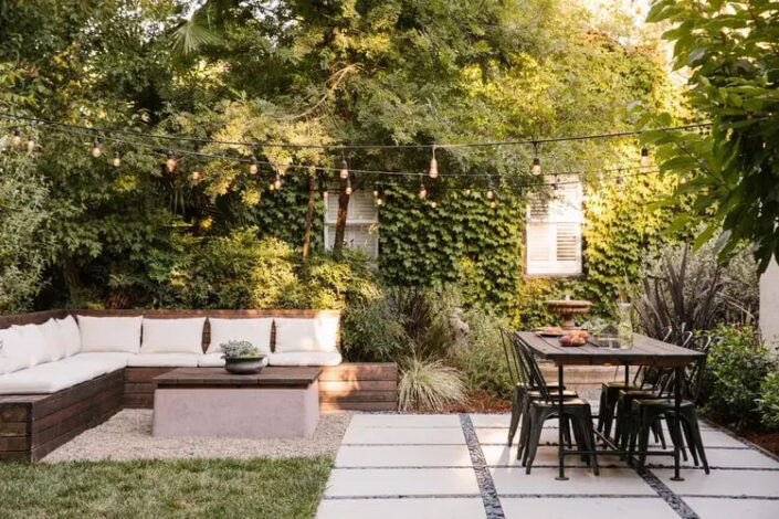 Backyard Patio Ideas with Pavers and Black chair Seating Area