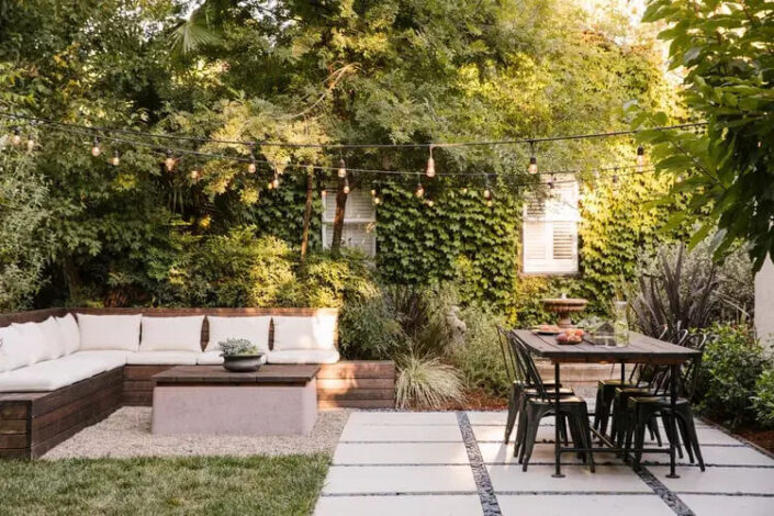 Backyard Patio Ideas with Pavers and Black chair Seating Area