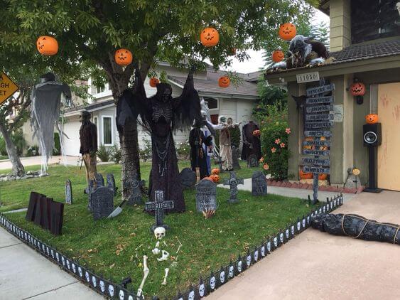 Small Front yard decor for Halloween with pupkin hanging and Skeleton and tomb